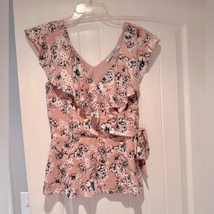 Wrap top with floral pattern and wrap/tie detail